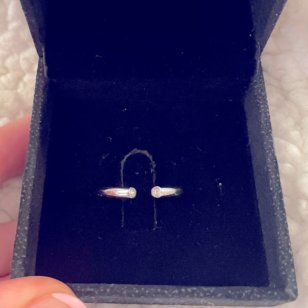 Stainless steel minimalist band with hidden cz stones.